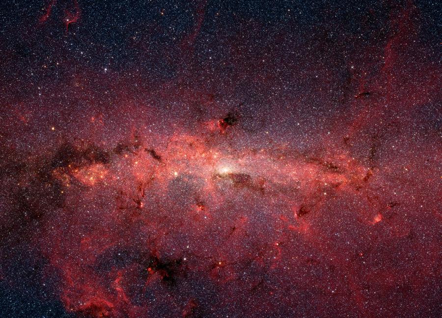  Imagen del centro de la galaxia obtenida con el telescopio espacial Spitzer, donde se pueden ver zonas de nubes moleculares. EFE